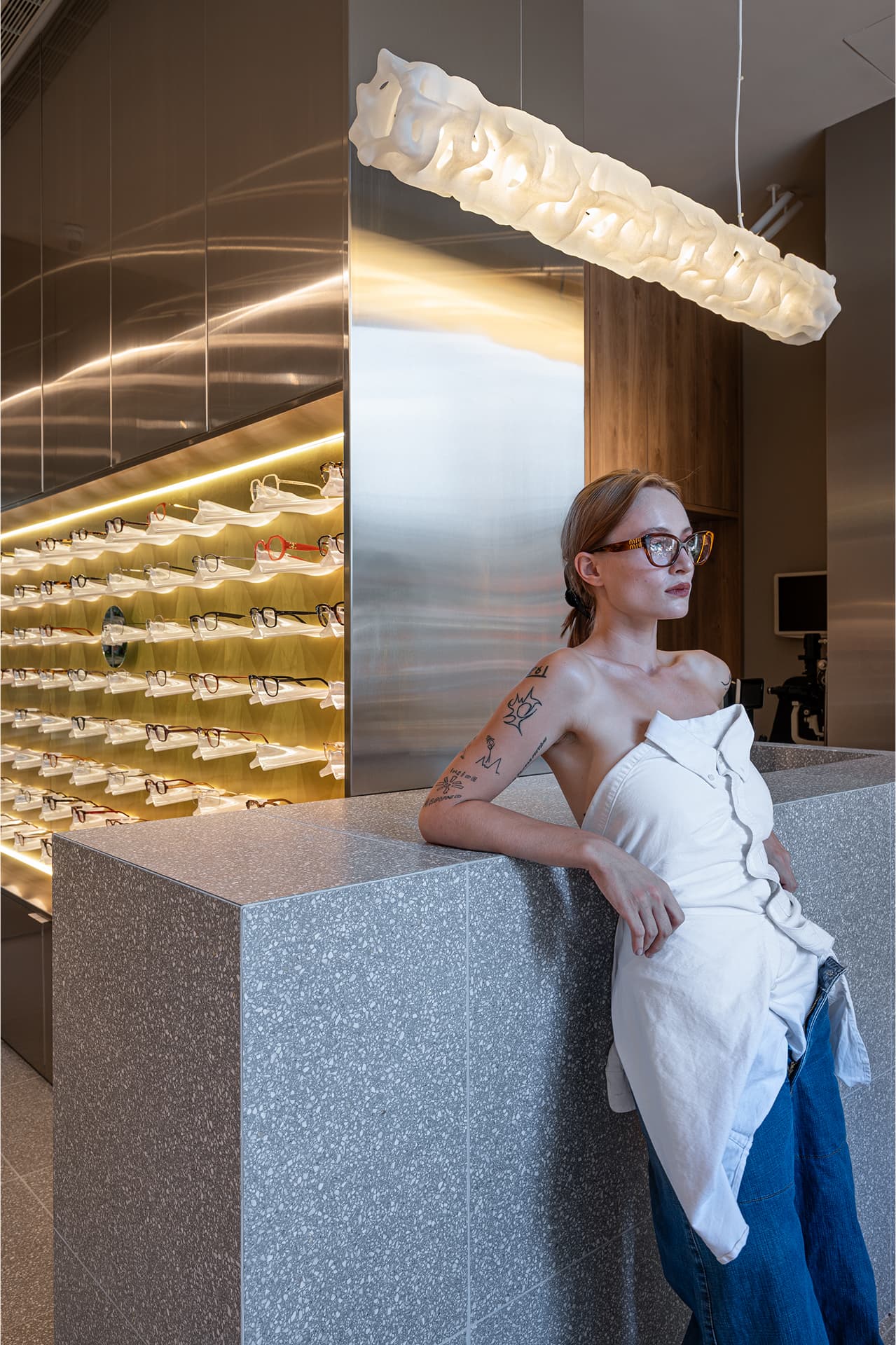 Portrait — terrazzo counter and backlit display