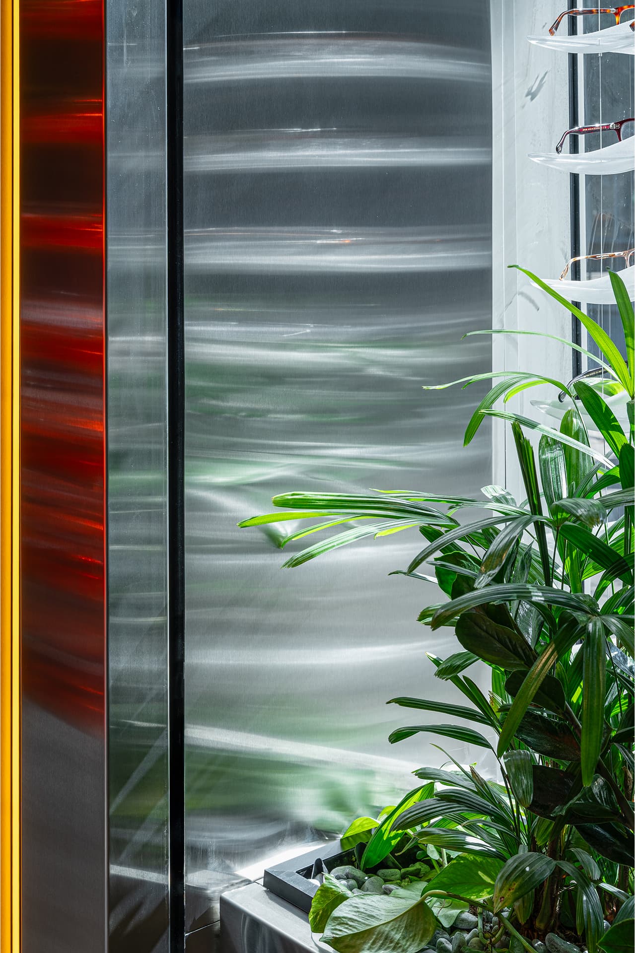 Stainless steel reflection and plants