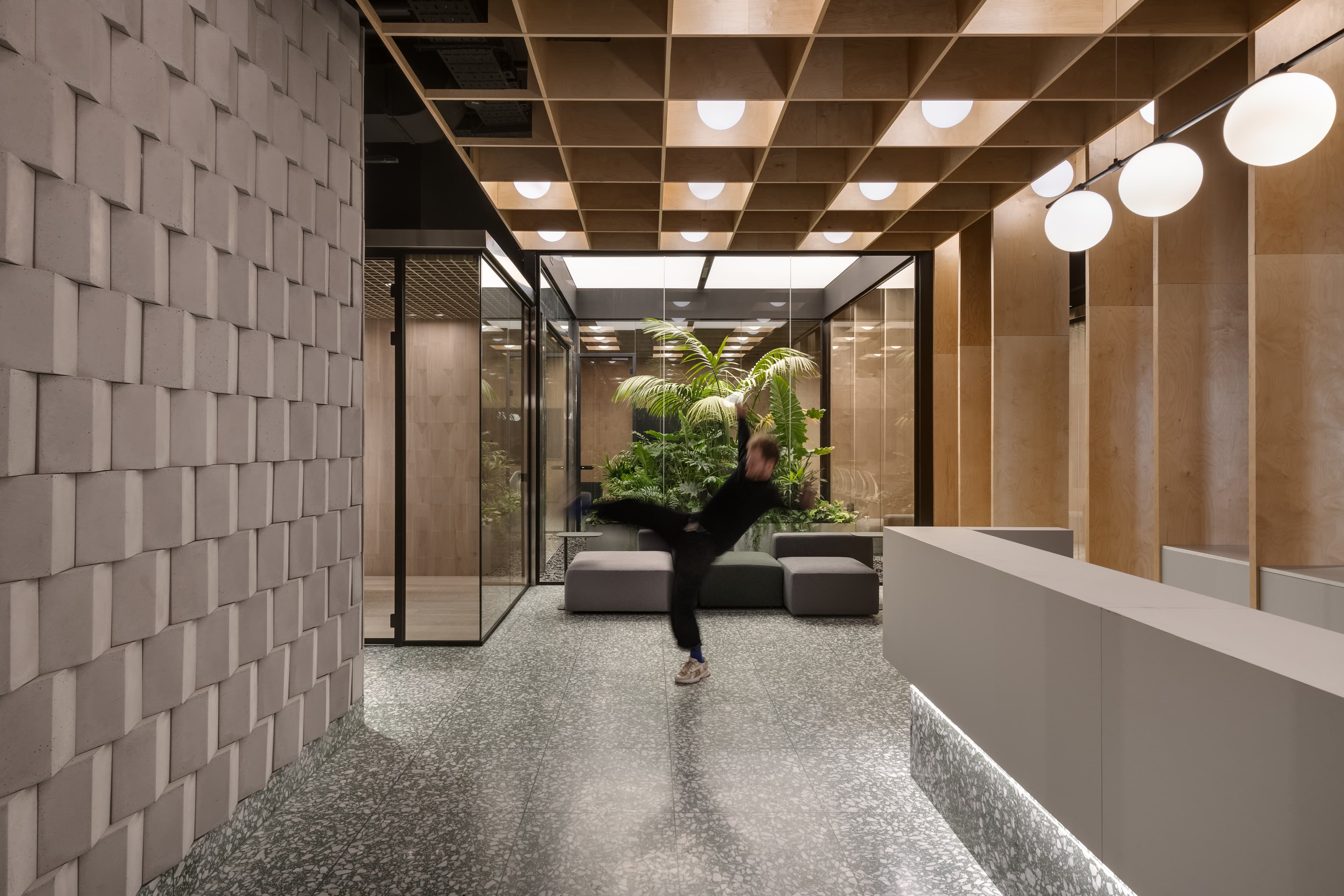 Tel Ad Office — planted patio and open workspace