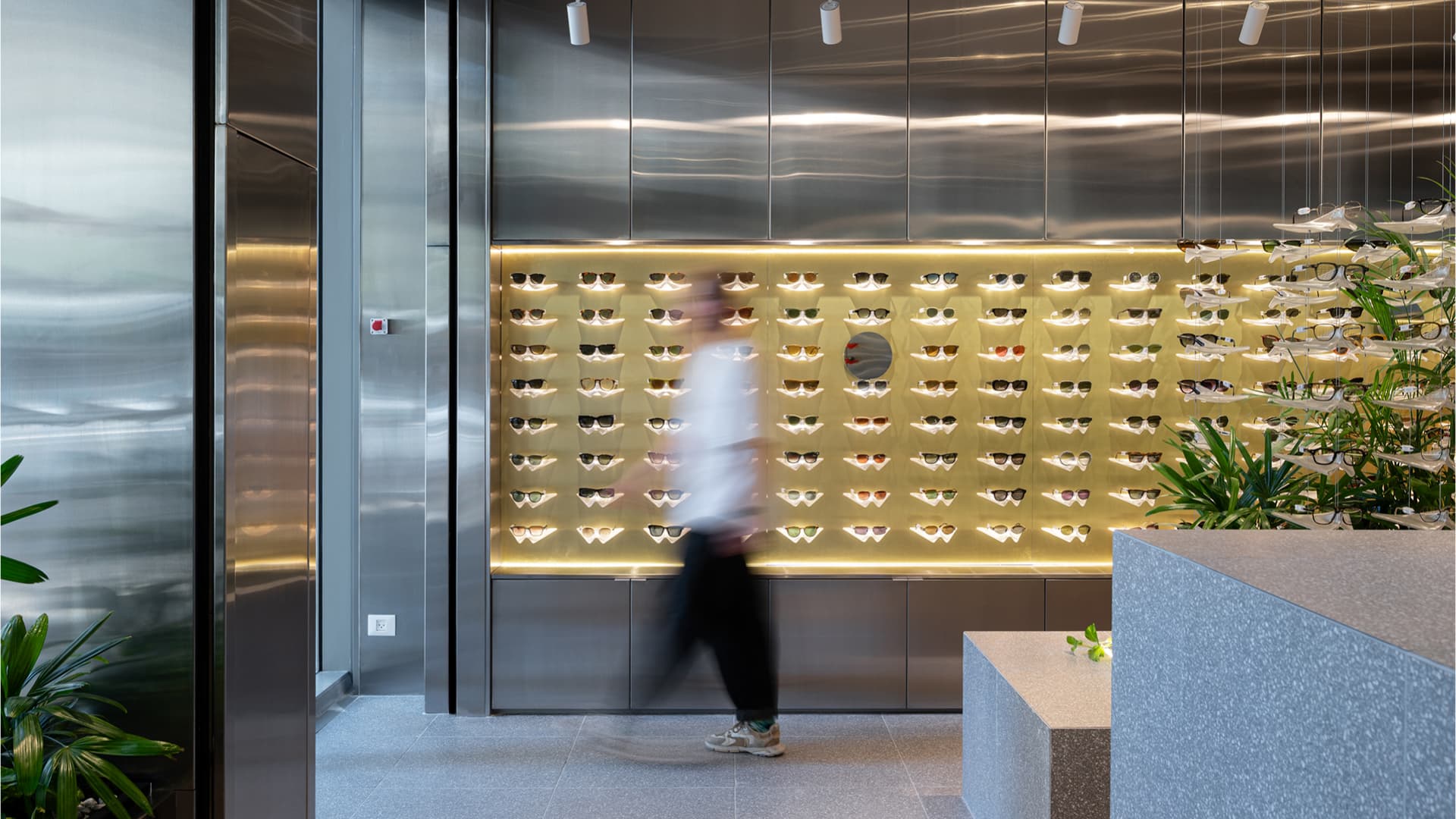 SAM&JO Eyewear Store — display wall