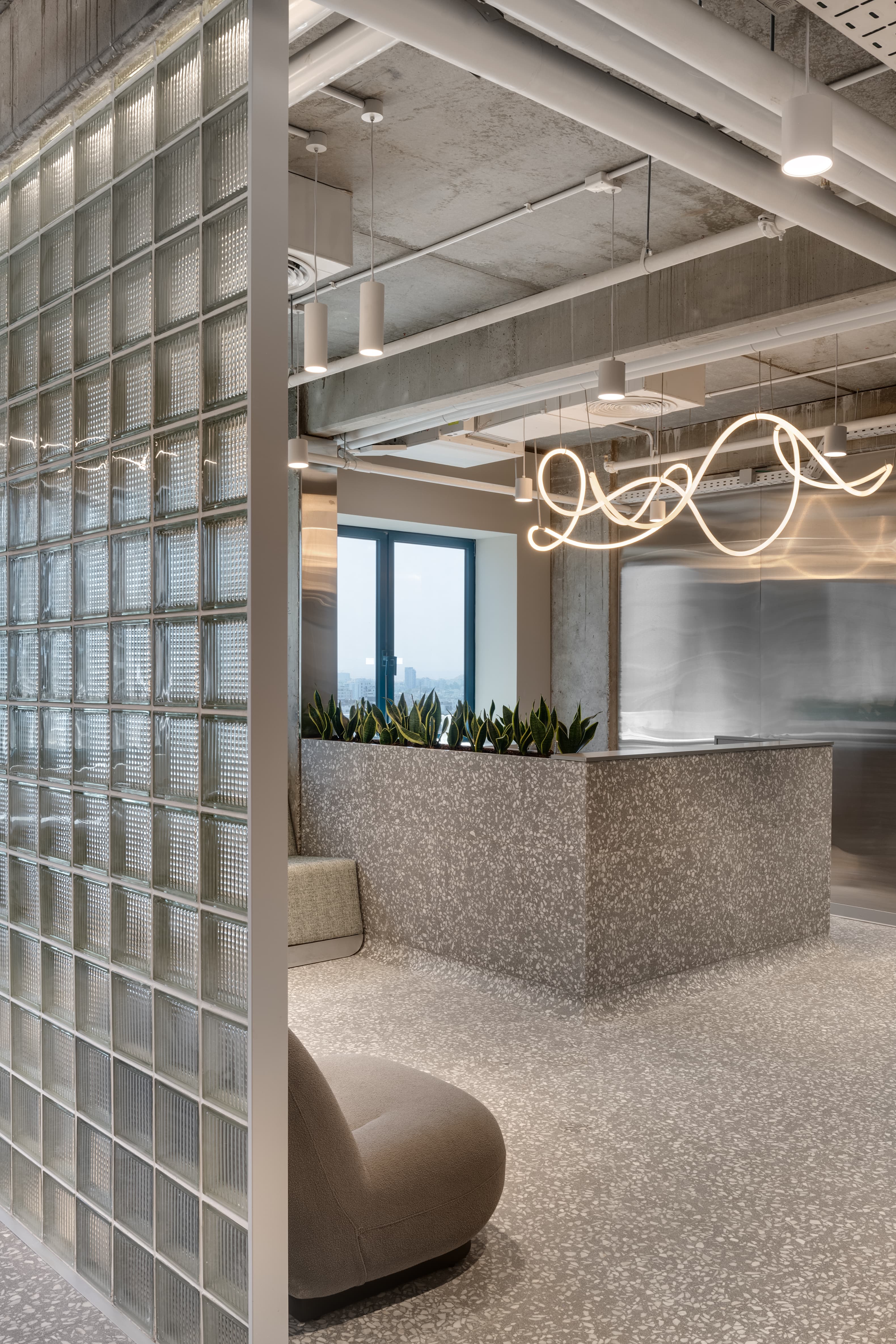 LYN Tower — workspace with raw ceiling