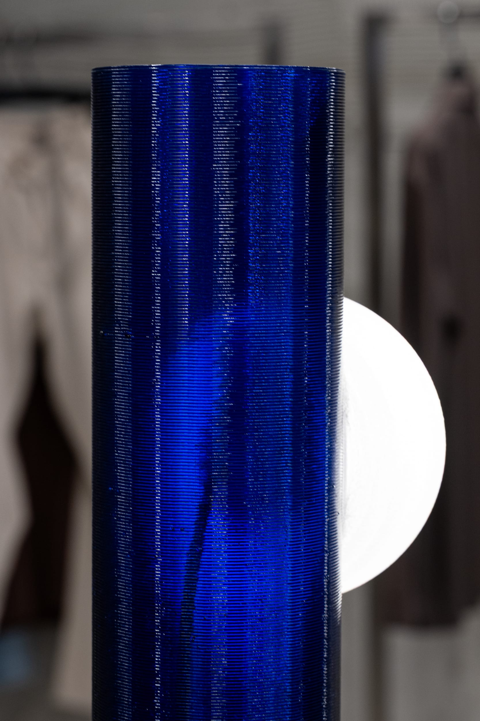Detail of the 3D-printed textured surface on the blue lamp column